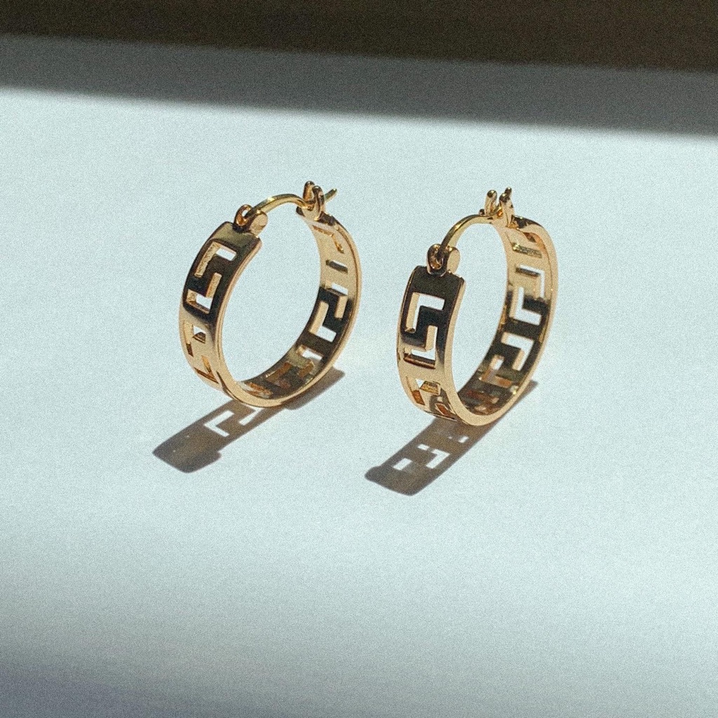18 carat gold hollow hoop earrings photographed for a marketplace listing